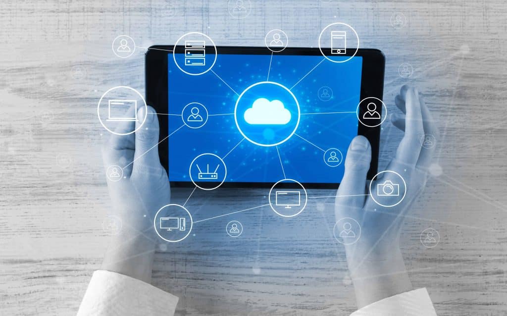 Hand touching tablet with cloud computing and online storage concept