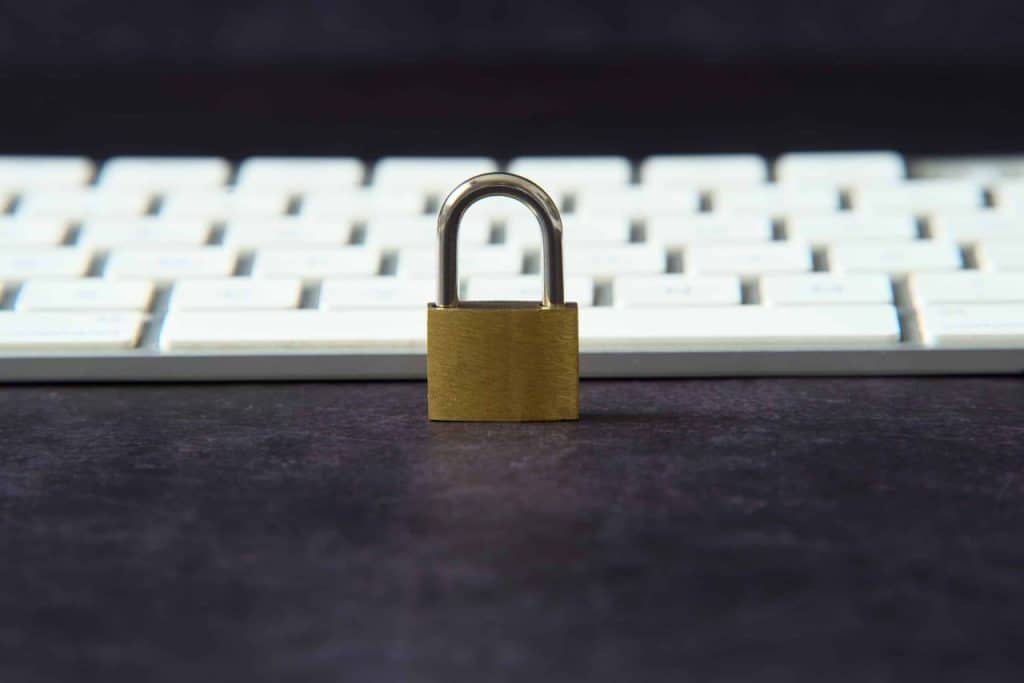 padlock in front of keyboard symbolizing cybersecurity