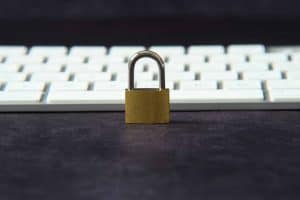 padlock in front of keyboard symbolizing cybersecurity